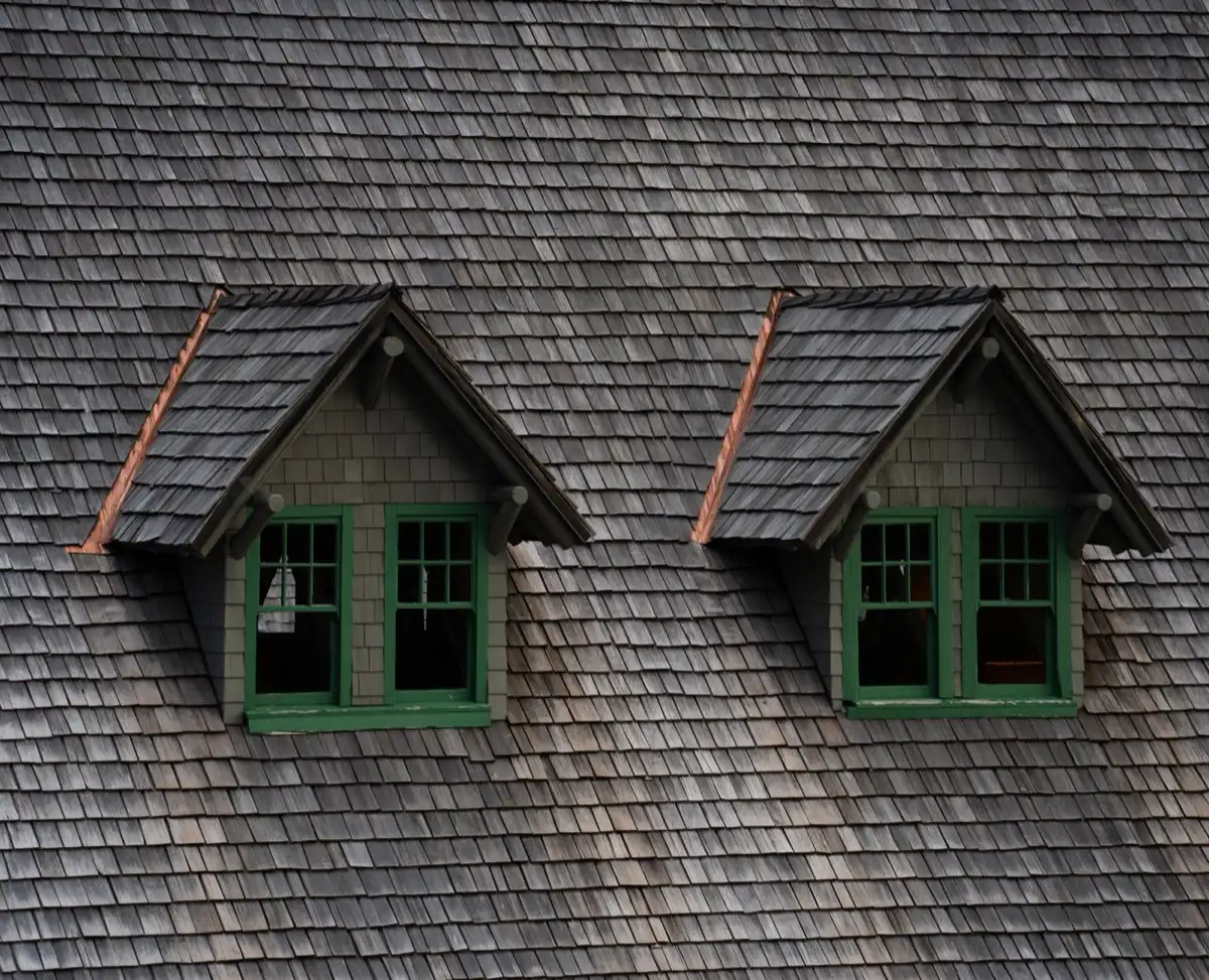 Dormers on a shingle roof in Yuma, AZ, where step flashing and kickout flashing carry water past the walls